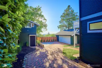 Expansive driveway leads to studio and large 2-car garage with plenty of off-street parking - a rare amenity in Seattle.