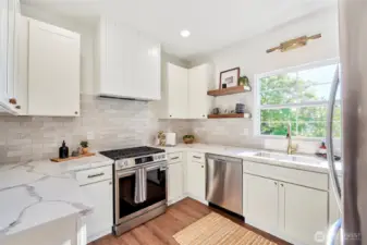 Stunning architectural finishes and custom hood design with window overlooking western views.