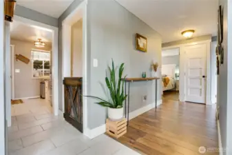 Step inside to a welcoming tile entry, where rich upgraded millwork, stylish doors, and polished hardwood floors set a sophisticated tone for this stunning home.