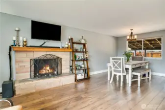 The wood-burning sandstone fireplace steals the show, anchoring the room with retro-cool vibes.