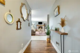 A strikingly wide hallway effortlessly links the living room to the bedrooms, adding a spacious, airy flow that enhances the home’s open, inviting vibe.