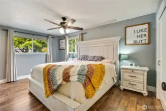 The primary bedroom, paired with a sleek en-suite 3/4 bathroom, offers a cozy, stylish retreat perfect for unwinding in comfort and modern flair.