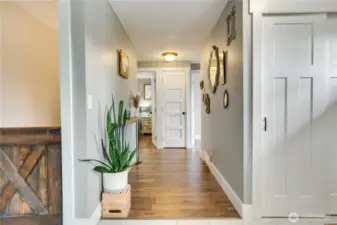 A trendy barn-style door opens to the finished basement.