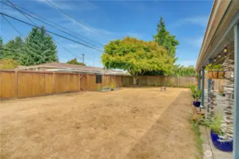 The spacious backyard offers a fun, open area for all to enjoy!