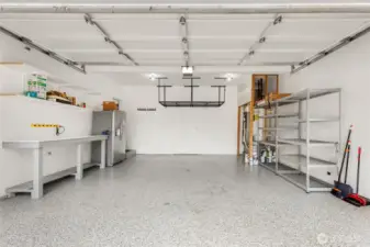 Epoxy flooring, over-head storage, work bench and 2nd fridge stays.