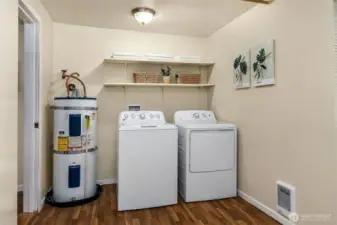 Huge laundry room offers plenty of storage space.