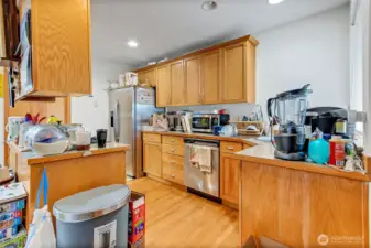 Lots of counter and cupboard space in the kitchen. Lovely hardwoods accent the cupboards.