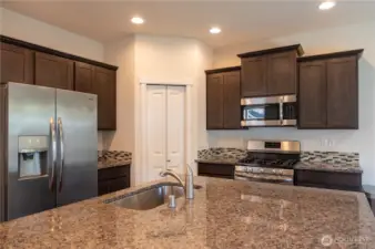 Large island with underneath cabinets and sink!
