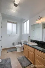 The three quarter bathroom is also abundant with storage.