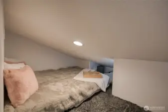 And the other half of the loft is currently in use as the sleeping quarters.  A cozy nest!