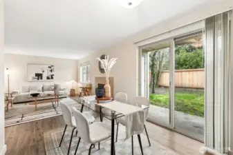 Glass sliding doors open to the outdoor patio and large private yard.