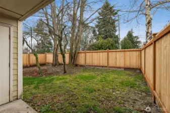Private outdoor patio with storage locker.