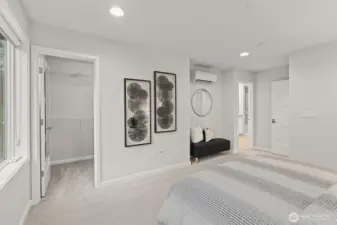 Primary bedroom with ensuite bathroom & walk-in closet (staged)