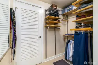 large walk in closet with wa/dryer