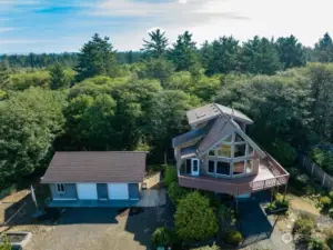 Uniquely designed home with ocean views, edge of the forest on a double lot.