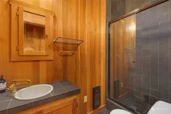 A three quarter bathroom off the hallway upstairs.