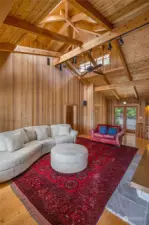 Vaulted ceiling in living room culminates in a cupola, adding extra light to the open space.