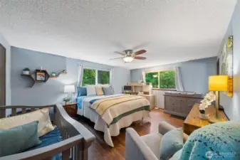 The huge primary bedroom holds many furnishing styles, with space for new arrivals, a bedroom office, dressers and sitting area.  Imagine how you would decorate this quiet retreat space.  Large walk-in closet and full bath too.