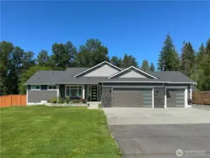 Long private driveway with RV parking plus 3 car garage