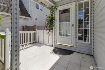 Tile front porch lightens up the east side of the entry to your home!