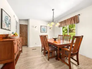 Dining off Kitchen and the door to the left leads to the huge Primary en Suite.