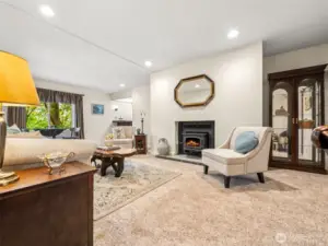 Additional space in the Living Room, complete with cozy wood-burning stove and wetbar -- this is a home made for entertaining!
