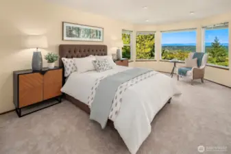 Luxurious oversized main suite provides stunning views and seating area to enjoy morning coffee or relax.