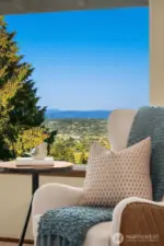 Serene sitting area overlooks the back yard and onto the foothills.