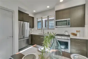 Love to cook and gather with friends? Full-size KitchenAid appliances include a French-door refrig, and gas range with convection oven.