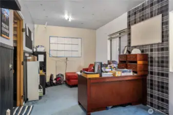 Huge bonus space on lower level with endless possibilities, currently being utilized as an office & weight room