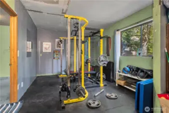 Huge bonus space on lower level with endless possibilities, currently being utilized as an office & weight room