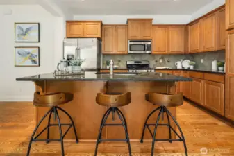 Oversized island offering bar seating.