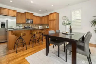 Open concept flow between kitchen and dining room.