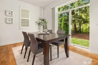 Dining space with sliding glass doors providing access to backyard.