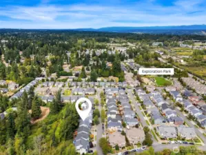 Aerial view of home showcasing close proximity to Exploration Park.