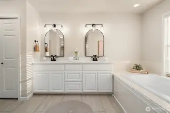 Elegant five-piece primary bathroom retreat.