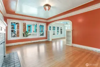 2 bedrooms & 1 bathroom on the main floor & showcases oak floors, foyer, coved ceilings, fireplace, picture molding & a period archway connecting the living & dining rooms.