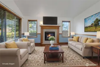 Living room with gas fireplace and great natural light