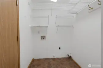 Laundry room with shelving