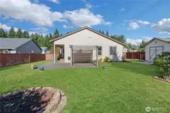 Back yard, fully fenced, large patio with gazebo, storage shed on the right