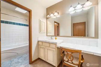 Unit A - Primary bedroom vanity and bathroom