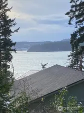 This is a view from the deck towards Cap Sante again.  Some careful plantings could obscure the roof below.