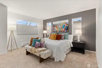 Spacious primary bedroom featuring walk-in closet and en suite bath.