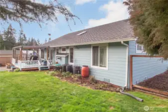 View of the back of the house and covered deck.