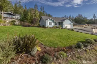 Front yard is slightly sloped towards the street.