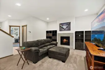 The living room features a cozy fireplace.