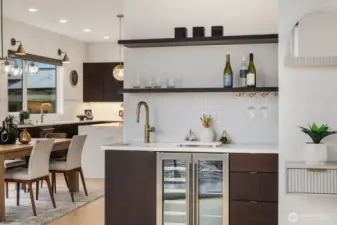Stylish beverage bar with wine fridge and open shelving