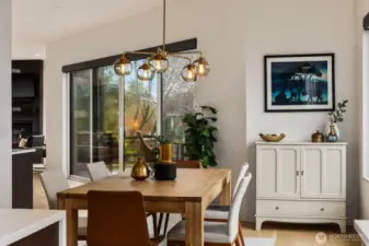 Dining area with large windows and deck access