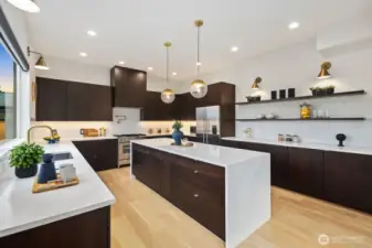 Chefs kitchen with oversized waterfall island