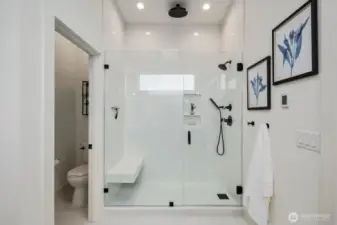 Frameless glass walk-in shower with modern finishes